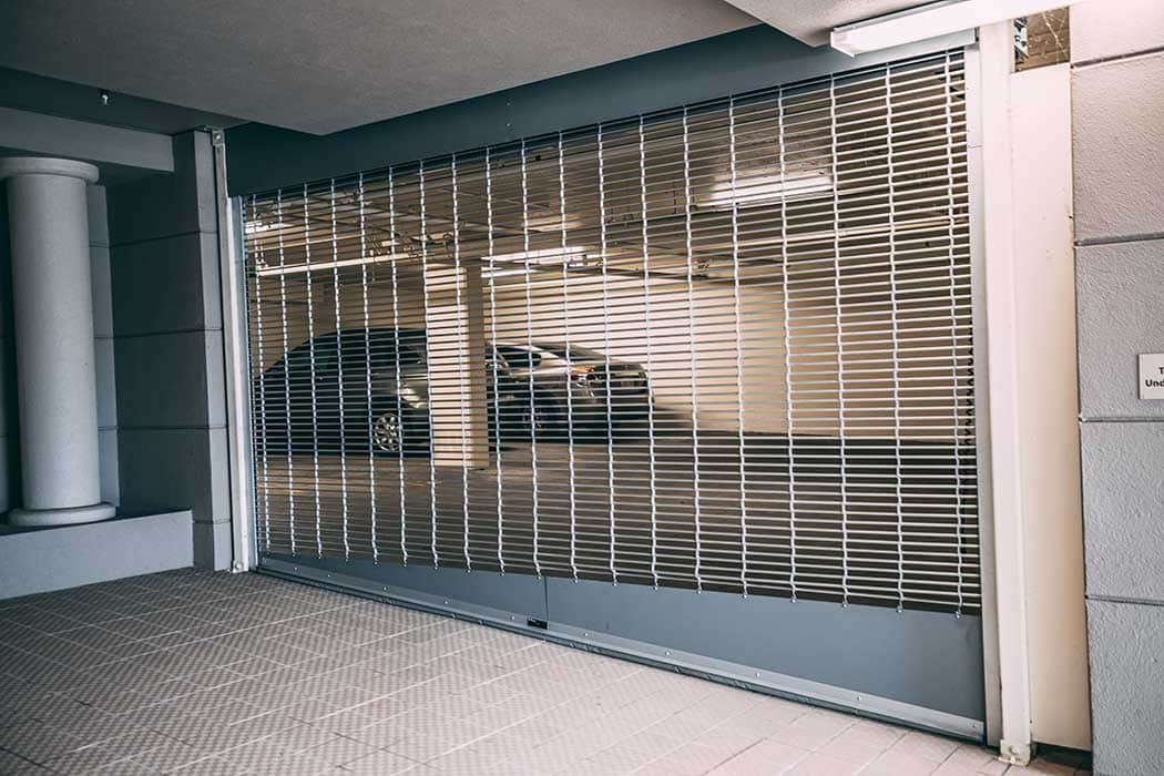 Custom slanted rolling gate to parking garage