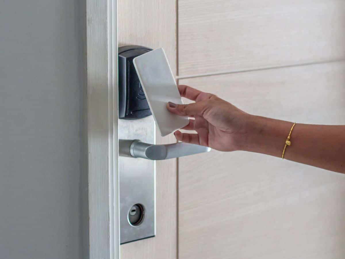 someone using a keycard to access a door